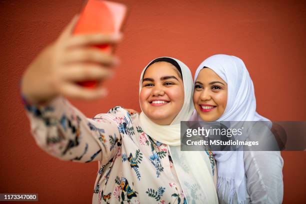making a selfie - chubby arab stock pictures, royalty-free photos & images