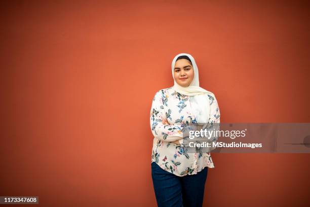 portrait of a smiling muslim teenager - arab people stock pictures, royalty-free photos & images