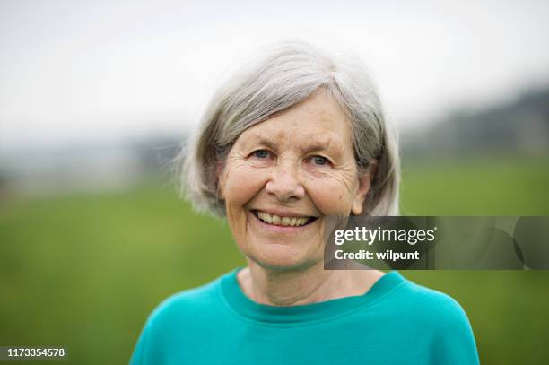 seniors woman portrait outdoors 70-79 years - 70 79 years stock pictures, royalty-free photos & images