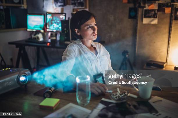 lady detective working late - fbi stock pictures, royalty-free photos & images
