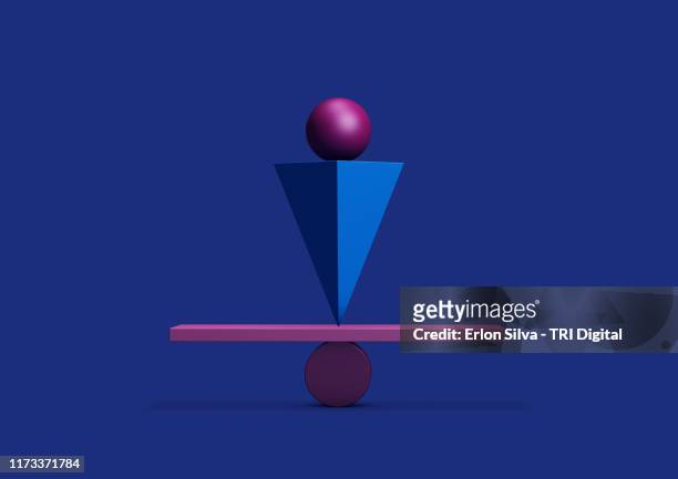 colorful balanced geometric shapes with equilibrium concepts - blue balls pics stock-fotos und bilder