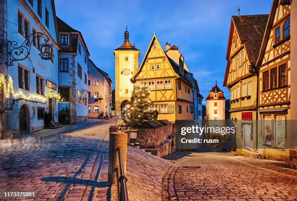 christmas night in rothenburg ob der tauber old town das plonlein, bavaria, germany - german culture stock pictures, royalty-free photos & images