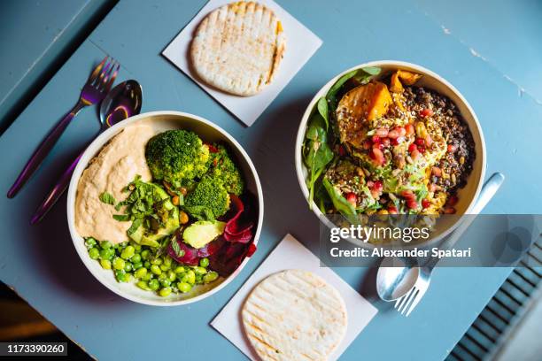 vegan bowls with various vegetables and seeds, high angle view - ヴィーガニズム ストックフォトと画像