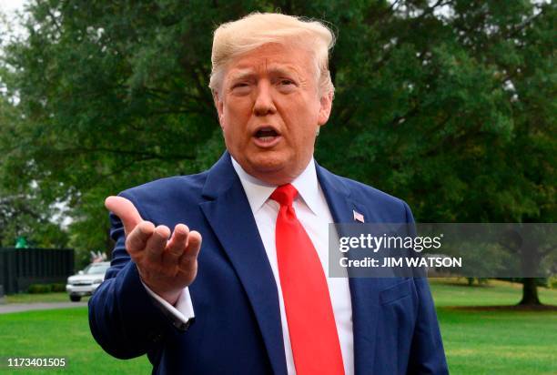 President Donald Trump speaks to the press as he departs the White House in Washington, DC, for Florida on October 3, 2019. - Trump said Thursday he...