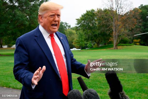 President Donald Trump speaks to the press as he departs the White House in Washington, DC, for Florida on October 3, 2019. - Trump said Thursday the...