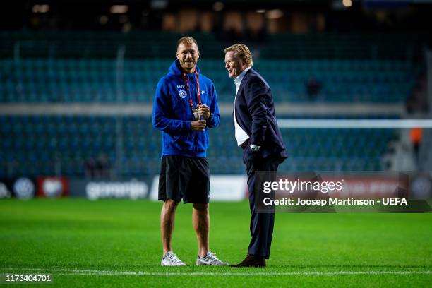 Head coach Ronald Koeman of Netherlands has a word with Ragnar Klavan of Estonia ahead of the UEFA Euro 2020 Qualifier group C match between Estonia...