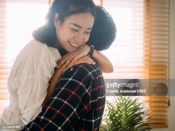 man holding woman near moving boxes - women wearing nothing stock pictures, royalty-free photos & images