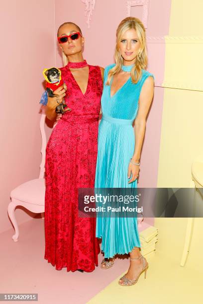 Paris Hilton and Nicky Hilton Rothschild attend the Alice + Olivia by Stacey Bendet arrivals during New York Fashion Week: The Shows on September 09,...