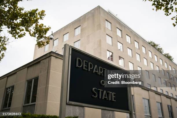 Signage is displayed outside the U.S. State Department headquarters in Washington, D.C., U.S., on Thursday, Oct. 3, 2019. Aides to Secretary of...