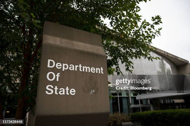 Signage is displayed outside the U.S. State Department headquarters in Washington, D.C., U.S., on Thursday, Oct. 3, 2019. Aides to Secretary of...