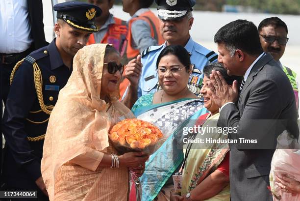 Bangladesh Prime Minister Sheikh Hasina is greeted as she arrives at the Palam Technical Airport, on a three-day visit to India on October 3, 2019 in...