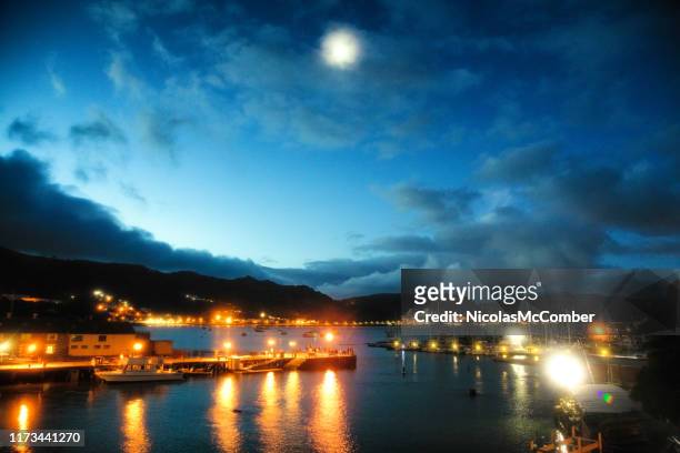 simon's town port at twilight with full moon and illuminated piers - moonlight stock pictures, royalty-free photos & images