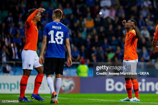 Georginio Wijnaldum of Netherlands celebrates his goal with Virgil van Dijk of Netherlands during the UEFA Euro 2020 Qualifier group C match between...