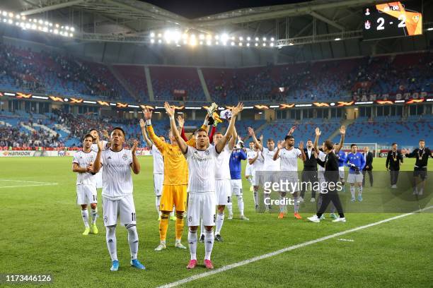 Basel players greet their fans after the UEFA Europa League group C football match between Trabzonspor and Basel at Medical Park Stadium in Trabzon,...