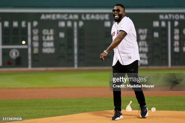 David Ortiz laughs after throwing out the ceremonial first pitch before the game between the Boston Red Sox and the New York Yankees at Fenway Park...