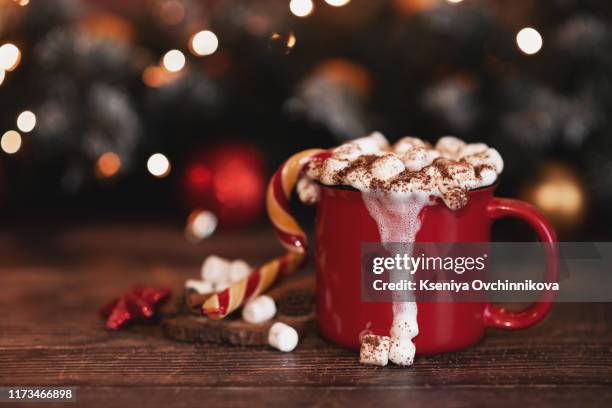 wooden desk space red mug and xmas tree - cocoa stock pictures, royalty-free photos & images