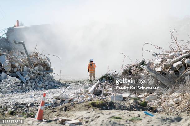 Worker looks at the deconstruction of Deans Stand during a media tour of Lancaster Park on September 10, 2019 in Christchurch, New Zealand. Being...
