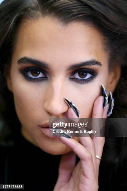 Model prepares backstage, makeup detail, for The Blonds x Moulin Rouge! The Musical during New York Fashion Week: The Shows on September 09, 2019 in...