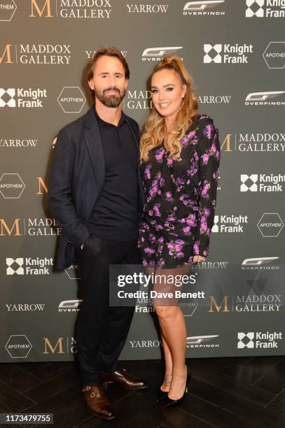 Jay Rutland and Tamara Ecclestone attend the VIP launch event for 'Pride Rock by David Yarrow' at Maddox Gallery on October 3, 2019 in London,...
