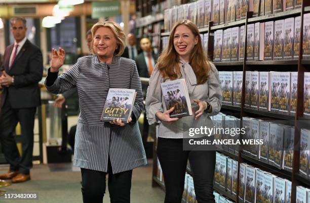 Former US Secretary of State and First Lady Hillary Rodham Clinton and Chelsea Clinton arrive to the book signing of their new book "The Book of...