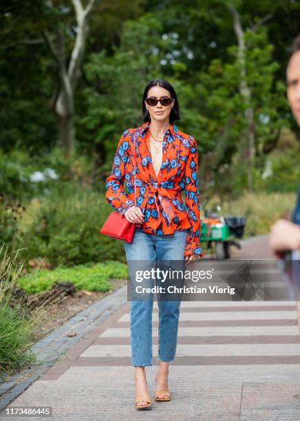 Brittany Xavier is seen wearing denim jeans, belted top with print outside Carolina Herrera during New York Fashion Week September 2019 on September...