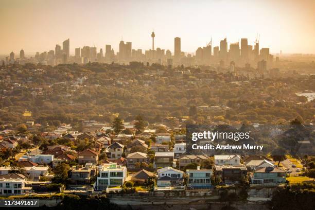 aerial photography of sydney skyline cityscape, suburb and houses on costal sea cliff, australia - housing problems - fotografias e filmes do acervo