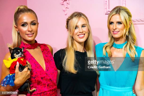 Paris Hilton, Tessa Hilton and Nicky Hilton attend the Alice + Olivia by Stacey Bendet presentation during New York Fashion Week: The Shows at Root...