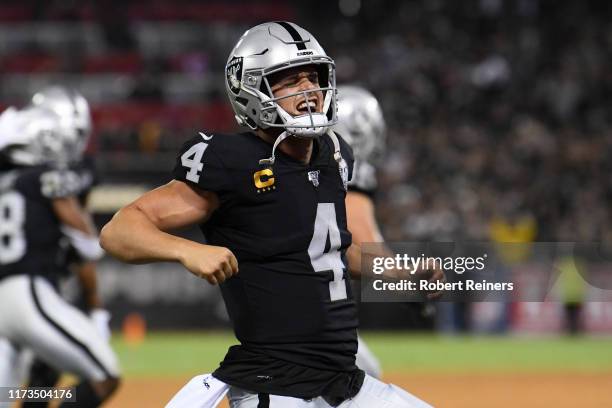 Derek Carr of the Oakland Raiders celebrates after a touchdown by Josh Jacobs during their NFL game against the Denver Broncos at RingCentral...