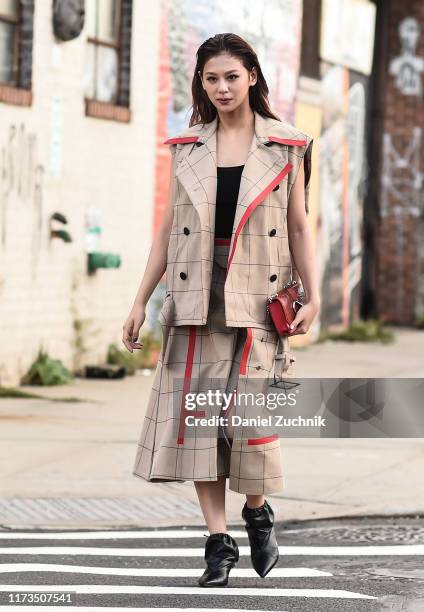 Mariya Nishiuchi is seen wearing a Phillip Limjacket and skirt with black shoes outside the Phillip Lim show during New York Fashion Week S/S20 on...