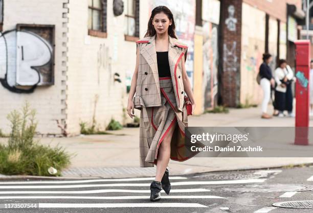 Mariya Nishiuchi is seen wearing a Phillip Lim jacket and skirt with black shoes outside the Phillip Lim show during New York Fashion Week S/S20 on...