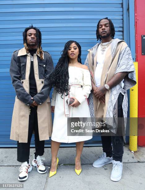Rapper Mango Foo , Hennessy Carolina and rapper Murk rock lean and clean khaki overcoats during New York Fashion Week at Pier 59 on September 8, 2019...
