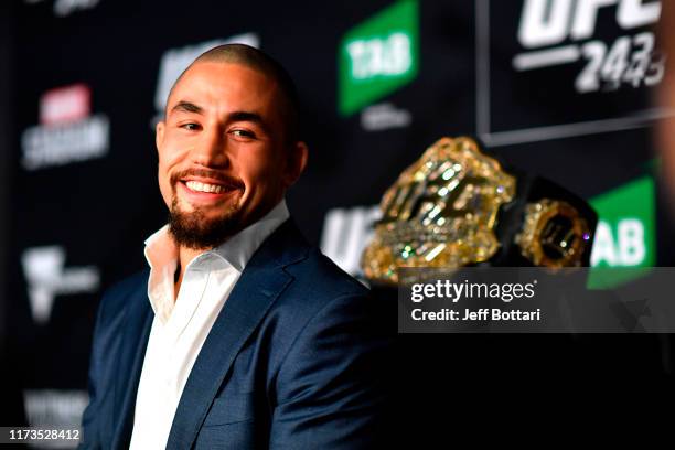 Middleweight champion Robert Whittaker of New Zealand interacts with media during UFC 243 Ultimate Media Day at Marvel Stadium on October 4, 2019 in...