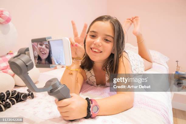 young youtuber girl recording video blog at home. vlogging. - toy camera stock pictures, royalty-free photos & images