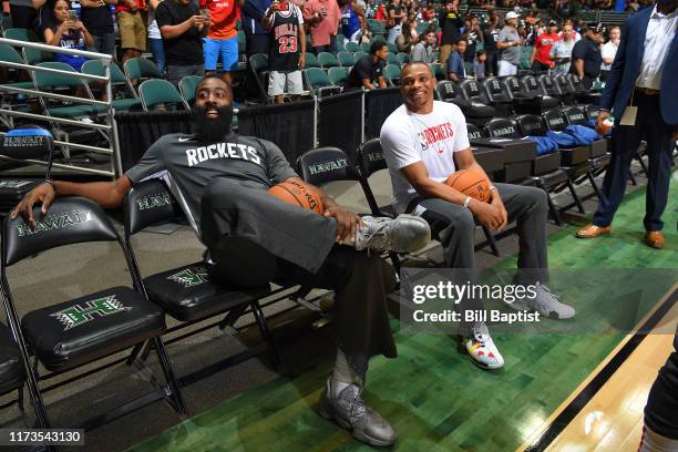 James Harden of the Houston Rockets and Russell Westbrook sit before the game against the LA Clippers on October 3, 2019 at the Stan Sheriff Center,...
