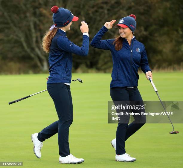 Michaela Morard and Rachel Heck of Team USA celebrate winning the hole during the PING Junior Solheim Cup during practice day 2 for The Solheim Cup...