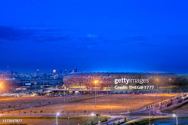fnb stadium with johannesburg city sunset - soweto home stock pictures, royalty-free photos & images