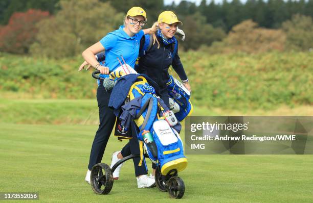 Hannah Darling and Annabell Fuller of Team Europe embrace as they walk off the 14th tee during the PING Junior Solheim Cup during practice day 2 for...