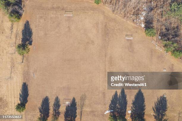 aerial view of dry soccer field in summer during drought - woodstock and aerial stock pictures, royalty-free photos & images