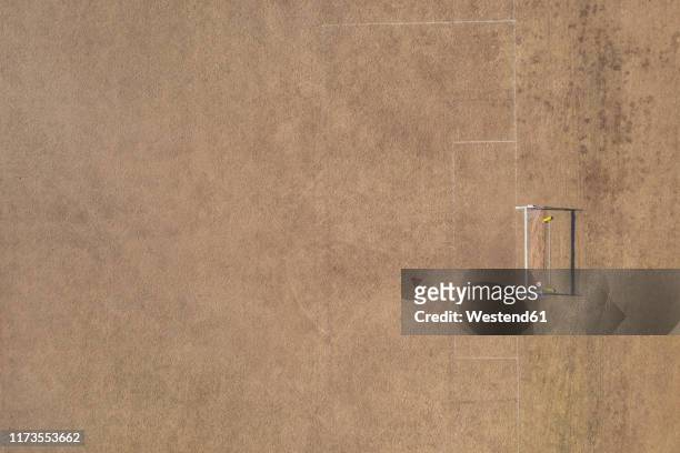 aerial view of goal post on dry soccer field in summer during drought - woodstock and aerial stock pictures, royalty-free photos & images