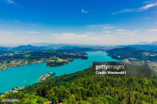 idyllic high angle view of islands in lake worthersee seen from pyramidenkogel tower - kärnten am wörthersee stock pictures, royalty-free photos & images