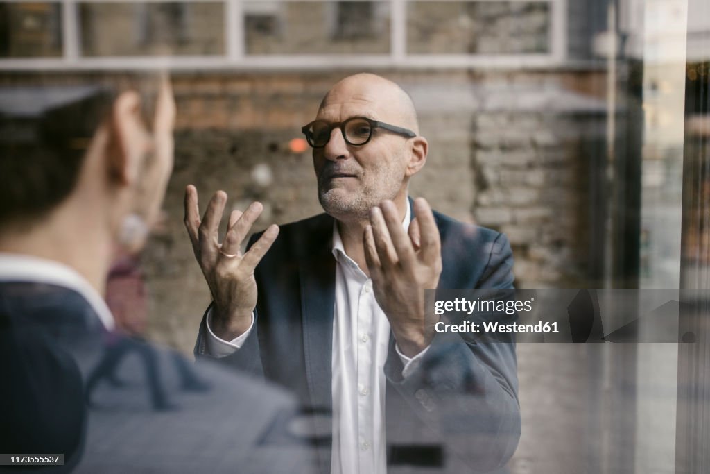 Portrait of senior and mid-adult businessman having a meeting