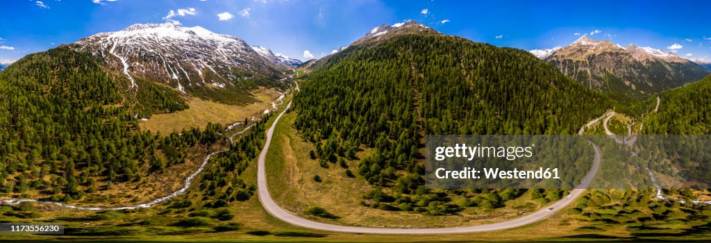 Scenic panorama of winding road across forested landscape of†Defereggen Valley, East†Tyrol, Austria