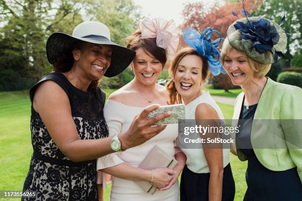 wedding guest selfie - woman fascinator stock pictures, royalty-free photos & images