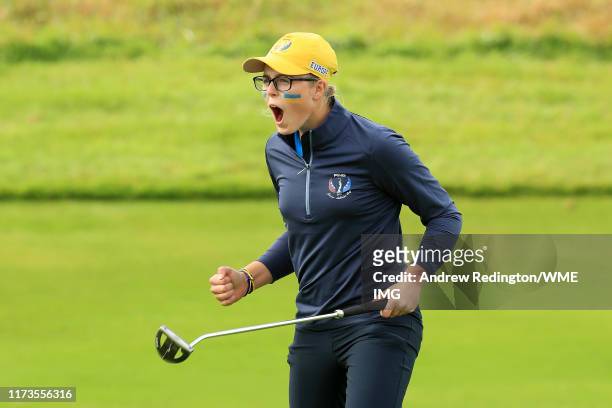 Hannah Darling of Team Europe celebrates after winning the match on the 15th green during the PING Junior Solheim Cup during practice day 2 for The...