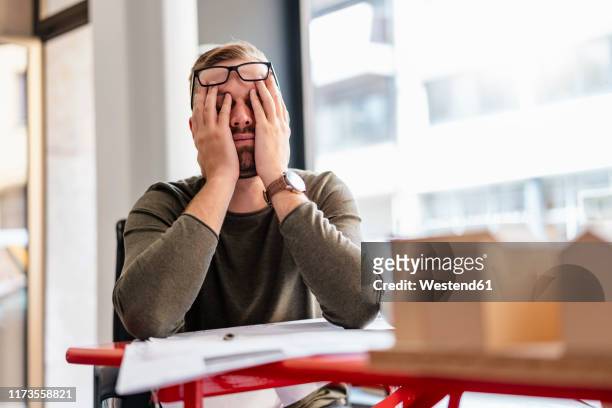 exhausted architect in office - frustration stock-fotos und bilder