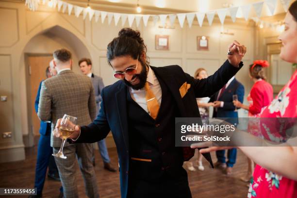 letting loose at a wedding reception - wedding reception stock pictures, royalty-free photos & images