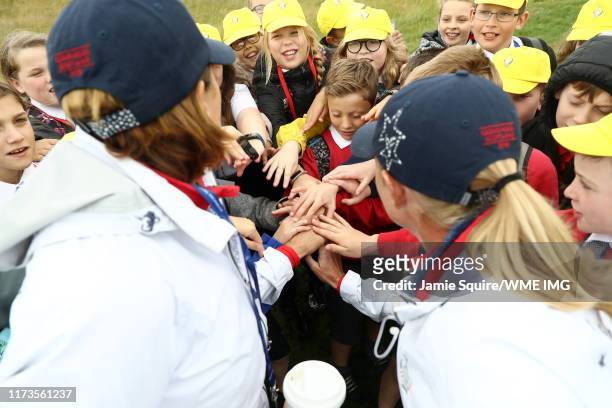 Team USA Captain Juli Inkster and Stacy Lewis have a team huddle with some School children during practice day 2 for The Solheim Cup at Gleneagles on...