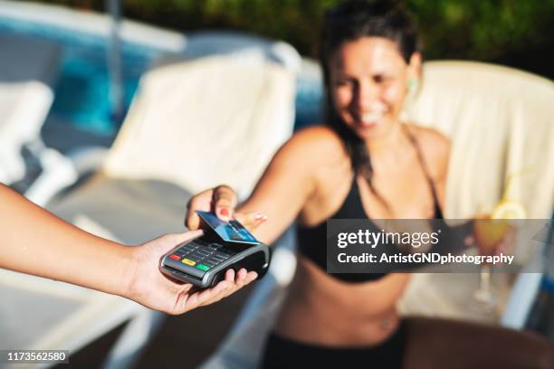 card payment - customers pay with contactless cards imagens e fotografias de stock