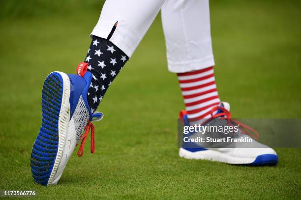 The patriotic socks and footwear of Jessica Korda of Team USA during a practice round prior to the start of The Solheim Cup at Gleneagles on...