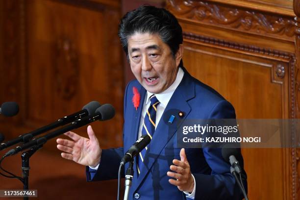Japan's Prime Minister Shinzo Abe delivers a policy speech at an "Extraordinary Diet" session in Tokyo on October 4, 2019.